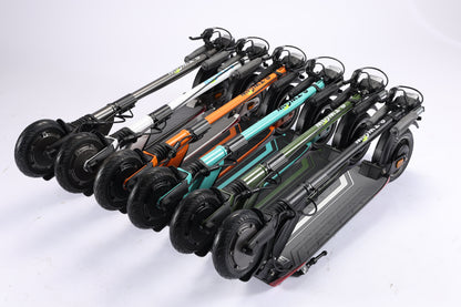 Multiple electric scooters in various colors arranged on a white background