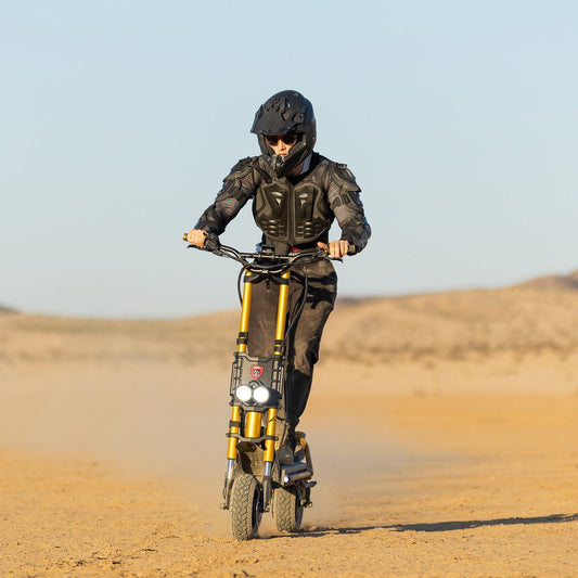 Rider on the Kaabo King GTR electric scooter in the desert