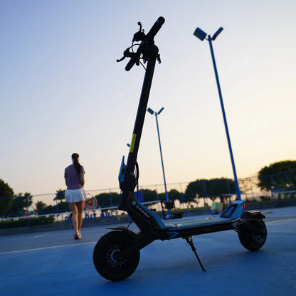 Silhouette of a person with an electric scooter on a tennis court at sunset.