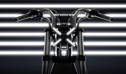 Motorcycle handlebar with headlight against a striped background