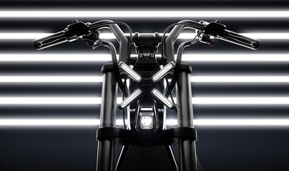Motorcycle handlebar with headlight against a striped background