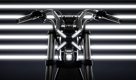 Motorcycle handlebar with headlight against a striped background