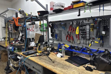 Workshop with tools on a pegboard and workbench