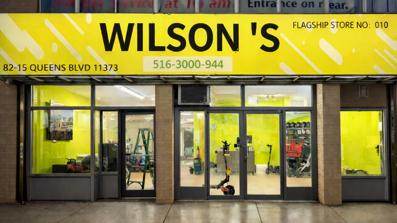  storefront with a yellow sign reading 'Wilson's' and a religious ministry sign above it.